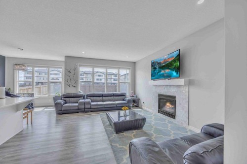 184 Cornerbrook Common Ne, Calgary, AB - Indoor Photo Showing Living Room With Fireplace