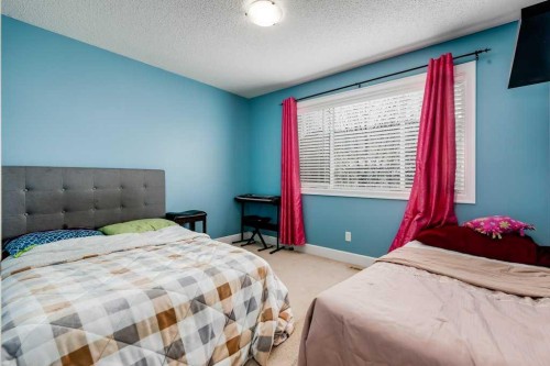 935 Windhaven Close Sw, Airdrie, AB - Indoor Photo Showing Bedroom