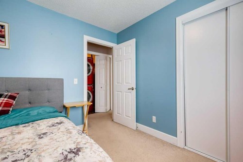 935 Windhaven Close Sw, Airdrie, AB - Indoor Photo Showing Bedroom