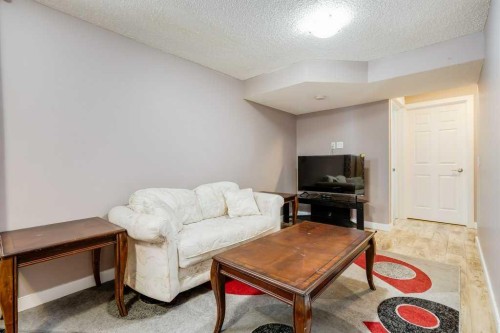 935 Windhaven Close Sw, Airdrie, AB - Indoor Photo Showing Living Room