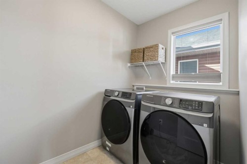344 Sunset View, Cochrane, AB - Indoor Photo Showing Laundry Room
