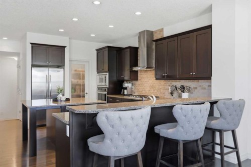 344 Sunset View, Cochrane, AB - Indoor Photo Showing Kitchen With Upgraded Kitchen