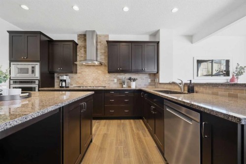 344 Sunset View, Cochrane, AB - Indoor Photo Showing Kitchen With Upgraded Kitchen