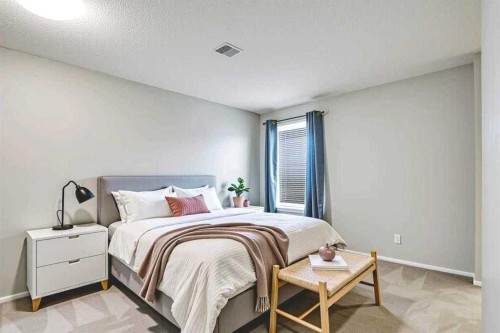 219 Coachway Lane Sw, Calgary, AB - Indoor Photo Showing Bedroom