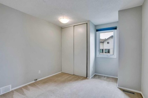 219 Coachway Lane Sw, Calgary, AB - Indoor Photo Showing Other Room