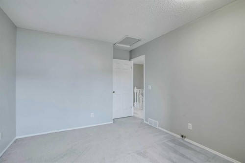 219 Coachway Lane Sw, Calgary, AB - Indoor Photo Showing Other Room