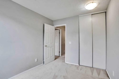 219 Coachway Lane Sw, Calgary, AB - Indoor Photo Showing Other Room