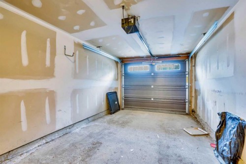 219 Coachway Lane Sw, Calgary, AB - Indoor Photo Showing Garage