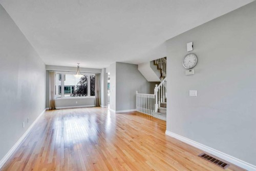 219 Coachway Lane Sw, Calgary, AB - Indoor Photo Showing Living Room