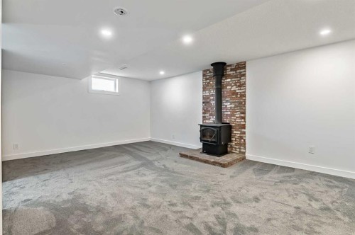 222 Springwood Place Sw, Calgary, AB - Indoor With Fireplace