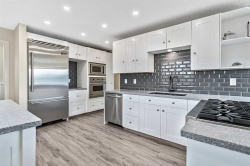 222 Springwood Place Sw, Calgary, AB - Indoor Photo Showing Kitchen With Upgraded Kitchen