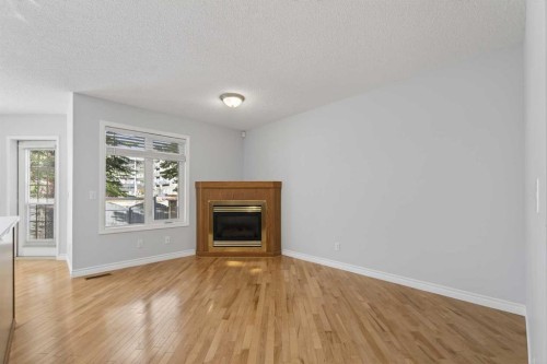 88 Scenic Gardens Nw, Calgary, AB - Indoor Photo Showing Living Room With Fireplace