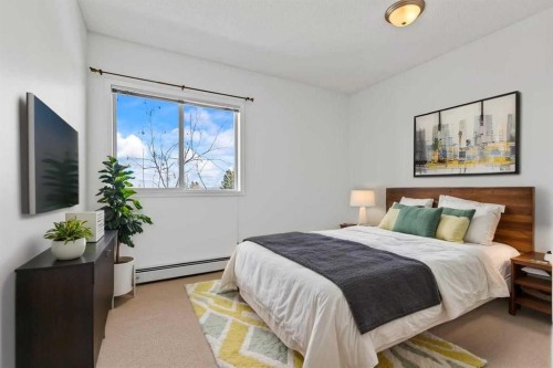 304-2022 Canyon Meadows Drive Se, Calgary, AB - Indoor Photo Showing Bedroom