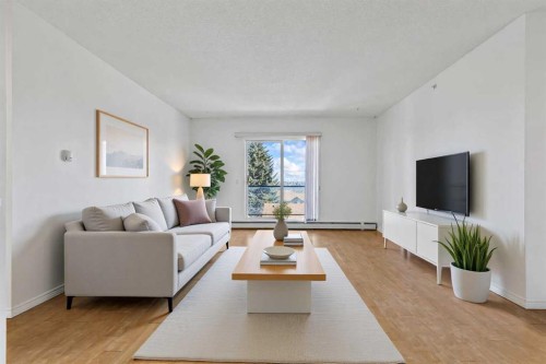 304-2022 Canyon Meadows Drive Se, Calgary, AB - Indoor Photo Showing Living Room