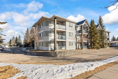 304-2022 Canyon Meadows Drive Se, Calgary, AB - Outdoor With Balcony With Facade