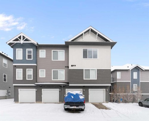 1103-24 Rivercrest Drive, Cochrane, AB - Outdoor With Facade