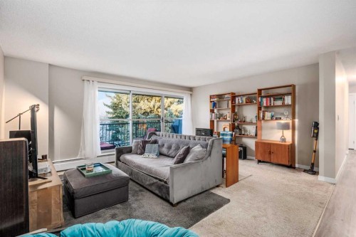 75D-231 Heritage Drive Se, Calgary, AB - Indoor Photo Showing Living Room