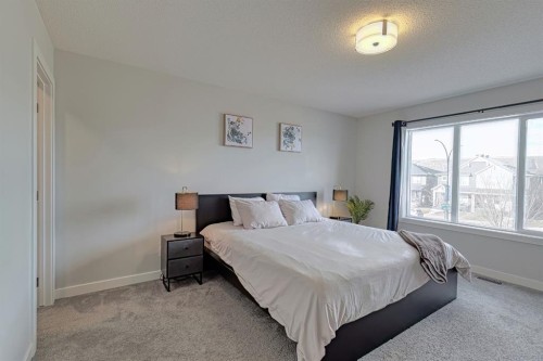 132 Wolf Willow Boulevard Se, Calgary, AB - Indoor Photo Showing Bedroom
