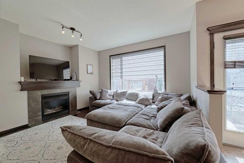 133 Evanspark Circle Nw, Calgary, AB - Indoor Photo Showing Living Room With Fireplace