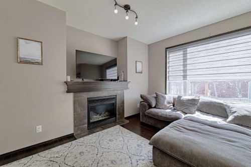 133 Evanspark Circle Nw, Calgary, AB - Indoor Photo Showing Living Room With Fireplace