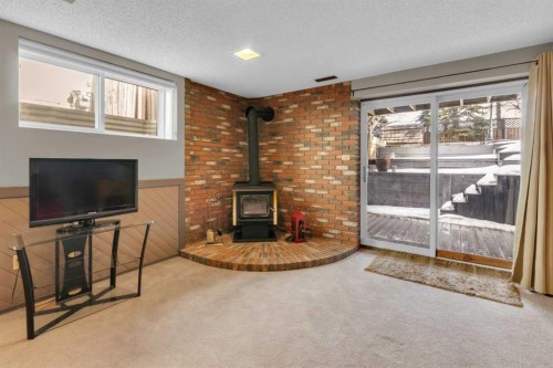 111 Edforth Place Nw, Calgary, AB - Indoor With Fireplace