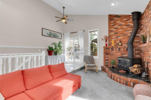 111 Edforth Place Nw, Calgary, AB - Indoor Photo Showing Living Room With Fireplace