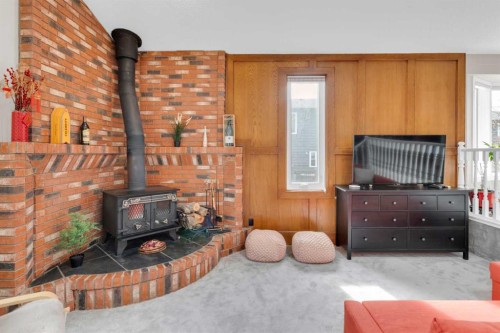 111 Edforth Place Nw, Calgary, AB - Indoor With Fireplace