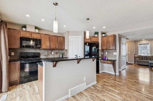 77 New Brighton Heights Se, Calgary, AB - Indoor Photo Showing Kitchen