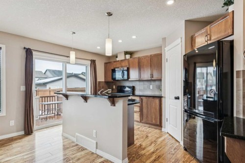 77 New Brighton Heights Se, Calgary, AB - Indoor Photo Showing Kitchen