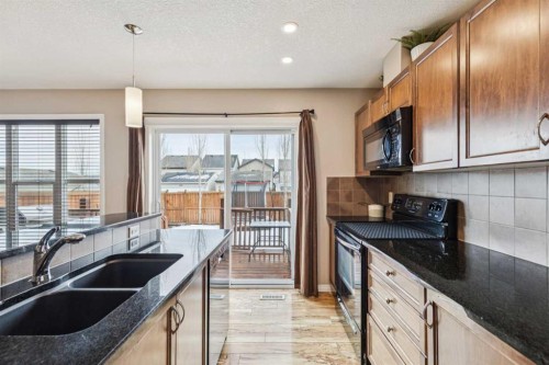 77 New Brighton Heights Se, Calgary, AB - Indoor Photo Showing Kitchen With Double Sink