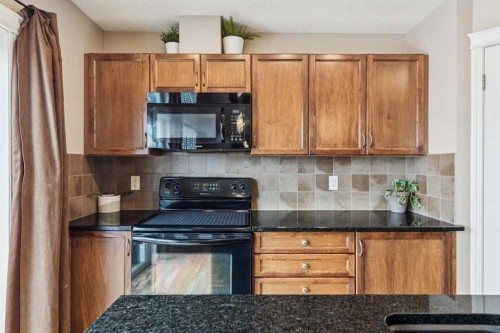 77 New Brighton Heights Se, Calgary, AB - Indoor Photo Showing Kitchen