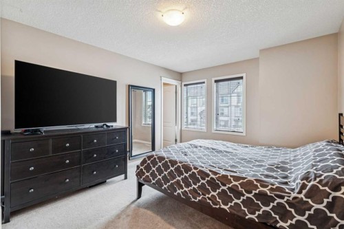 77 New Brighton Heights Se, Calgary, AB - Indoor Photo Showing Bedroom