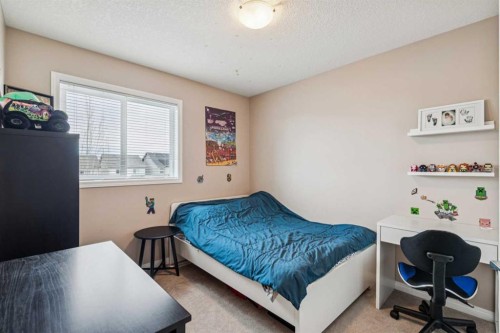 77 New Brighton Heights Se, Calgary, AB - Indoor Photo Showing Bedroom