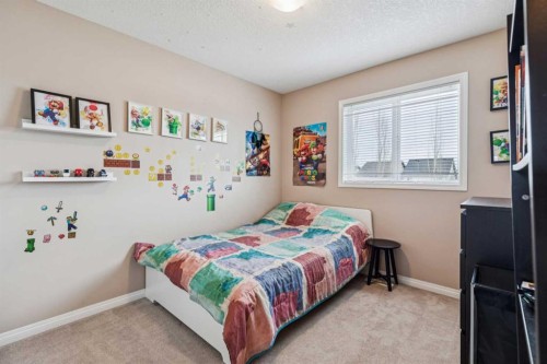 77 New Brighton Heights Se, Calgary, AB - Indoor Photo Showing Bedroom