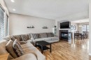77 New Brighton Heights Se, Calgary, AB  - Indoor Photo Showing Living Room With Fireplace 