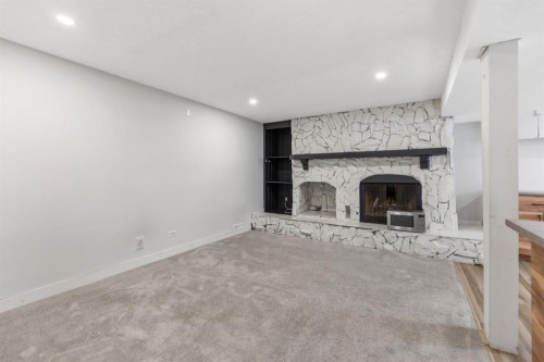 259 Manora Crescent Ne, Calgary, AB - Indoor With Fireplace
