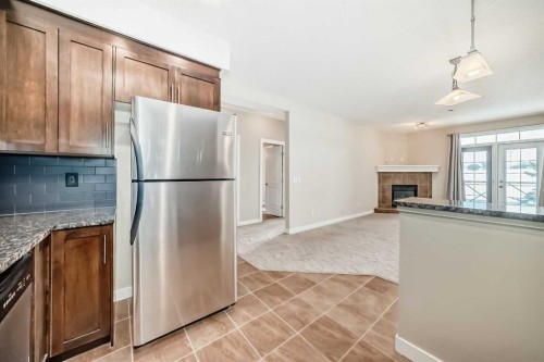 206-1005B Westmount Drive, Strathmore, AB - Indoor Photo Showing Kitchen With Stainless Steel Kitchen