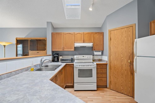 78 Coventry View Ne, Calgary, AB - Indoor Photo Showing Kitchen With Double Sink