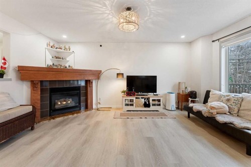 140 Fairways Drive Nw, Airdrie, AB - Indoor Photo Showing Living Room With Fireplace