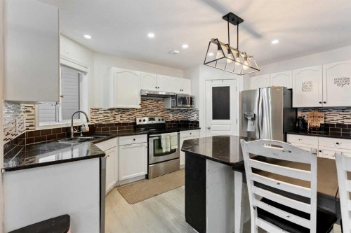 140 Fairways Drive Nw, Airdrie, AB - Indoor Photo Showing Kitchen With Stainless Steel Kitchen With Upgraded Kitchen