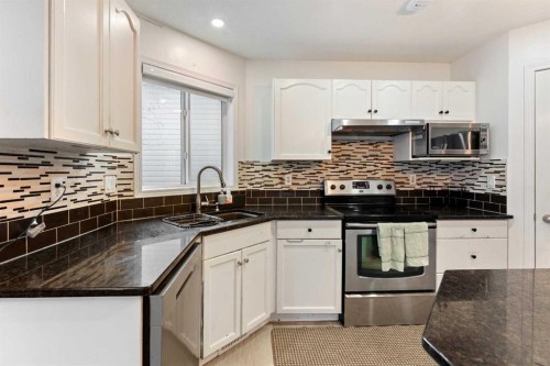 140 Fairways Drive Nw, Airdrie, AB - Indoor Photo Showing Kitchen With Stainless Steel Kitchen