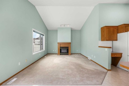 302 Arbour Ridge Park Nw, Calgary, AB - Indoor With Fireplace
