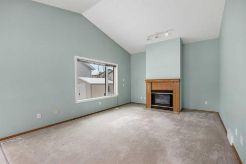 302 Arbour Ridge Park Nw, Calgary, AB - Indoor With Fireplace