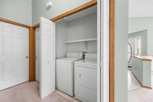 302 Arbour Ridge Park Nw, Calgary, AB - Indoor Photo Showing Laundry Room