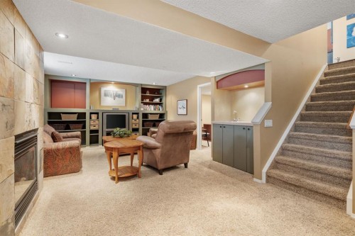212 Sirocco Place Sw, Calgary, AB - Indoor With Fireplace