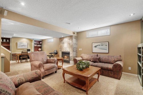 212 Sirocco Place Sw, Calgary, AB - Indoor With Fireplace