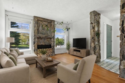 96 Jensen Crescent Ne, Airdrie, AB - Indoor Photo Showing Living Room With Fireplace