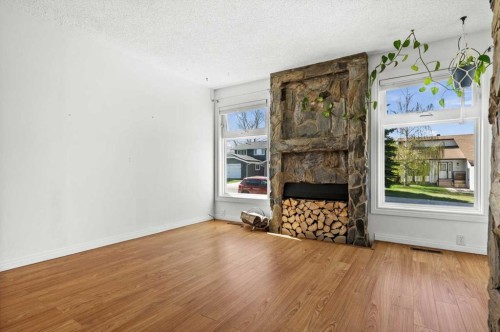 96 Jensen Crescent Ne, Airdrie, AB - Indoor With Fireplace