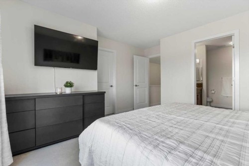 1303 New Brighton Park Se, Calgary, AB - Indoor Photo Showing Bedroom
