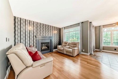 2 Tuscany Estates Crescent Nw, Calgary, AB - Indoor Photo Showing Living Room With Fireplace